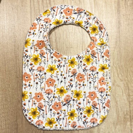 Babero Flores naranja y amarillo
